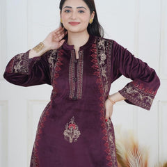 The rich plum shade enhances its appeal, while the handcrafted detailing on the neckline and sleeves ensures refined perfection. Tailored in a comfortable straight-fit silhouette, it offers both class and comfort, making it a graceful choice for win