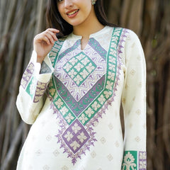 Add a touch of graceful charm to your winter wardrobe with this beautifully embroidered woollen kurti. Designed in an elegant base with intricate embroidery, this piece brings heritage craft together with