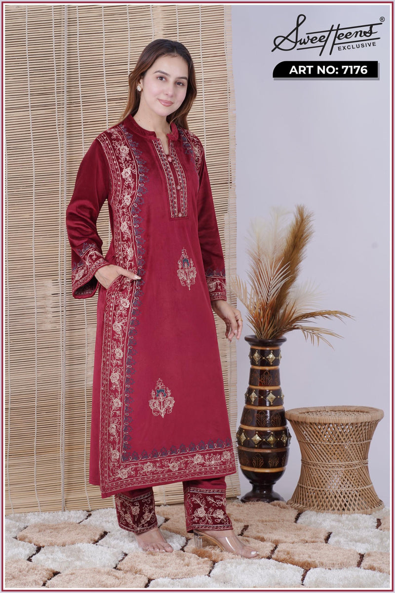 Step into elegance with our Sweetheens Exclusive Crafted from premium velvet fabric, this ensemble radiates royal sophistication and comfort. Adorned with intricate hand embroidery along the neckline, sleeves, and hem, every detail reflects