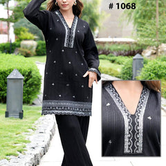 Mulson Design a timeless black co-ord set that defines sophisticated elegance. Tailored to perfection, this ensemble features a beautifully embroidered kurta with fine thread detailing on the neckline and hem, paired with straight-fit