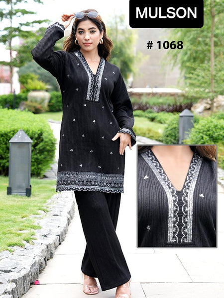 Mulson Design a timeless black co-ord set that defines sophisticated elegance. Tailored to perfection, this ensemble features a beautifully embroidered kurta with fine thread detailing on the neckline and hem, paired with straight-fit