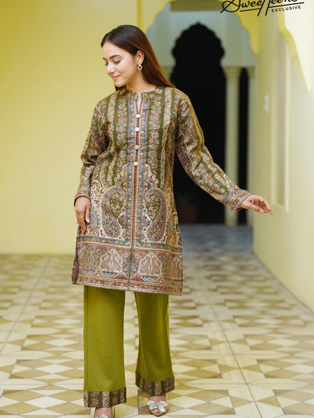 A beautifully crafted ethnic kurti featuring rich Kashmiri-inspired tapestry design in warm earthy hues. Designed with intricate detailing and a timeless silhouette, this piece brings effortless elegance to every occasion. Perfect for festive gatherings,